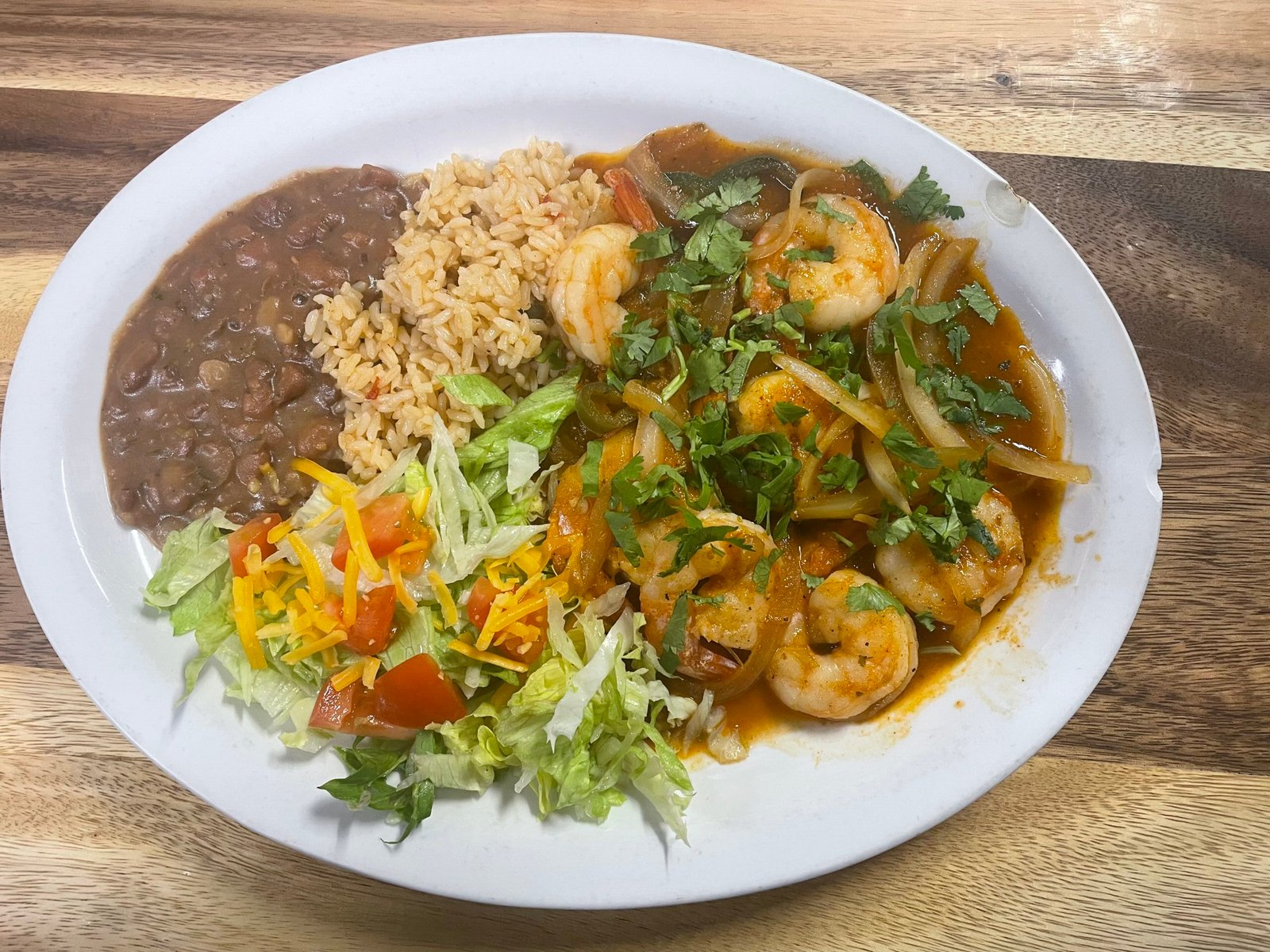 Tex-Mex shrimp entree served with rice, beans, and salad at Anita's Tex-Mex