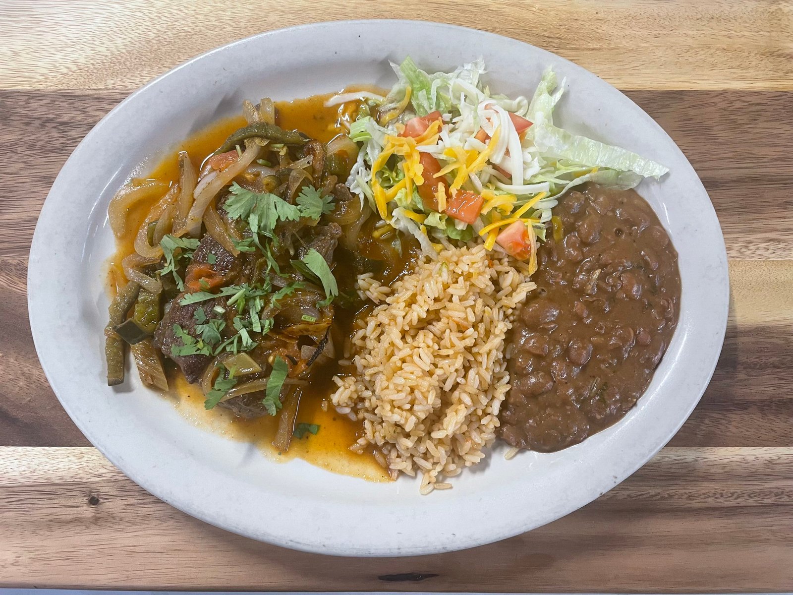 Steak Ranchero served with rice, beans, and salad at Anita's Tex-Mex